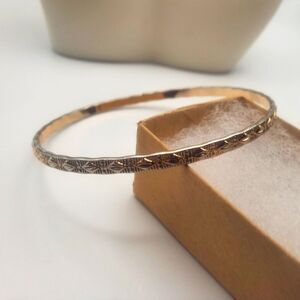 Gold toned Aztec signs bracelet‎